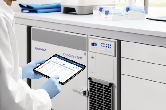 Scientist looking for specific sample in sample management software while sitting in front of Eppendorf CryoCube_REG_ F101h ULT freezer