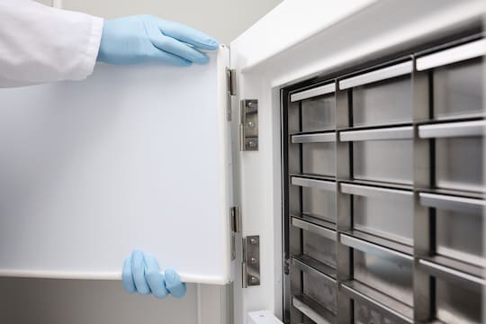 Scientist removing the inner door of an Eppendorf CryoCube® F101h ULT freezer