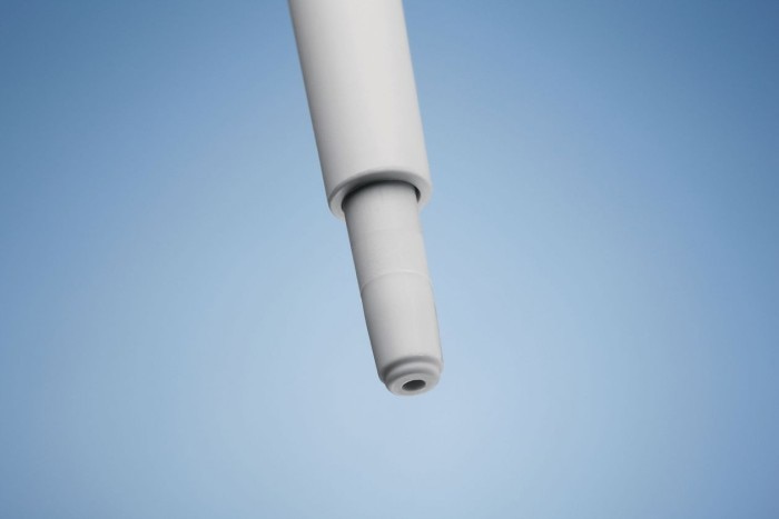 Comfortable handle for your pipette carousel. A tip cone of an Eppendorf pipette and blue background.