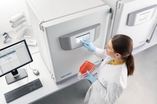 PhysioCare Concept® - Cell Culture A scientist is programming a CO2 incubator ergonomically located on the lab bench.