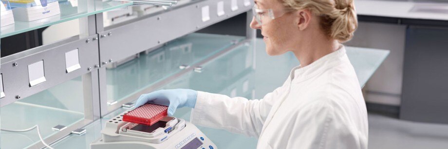 PhysioCare Concept® - Mixing and Heating A scientist transfers samples into a temperature control and mixing instrument.