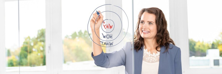 Why chossing Eppendorf for your OEM partnership. Original equipment manufacturer: woman drawing a circle on glasswall.