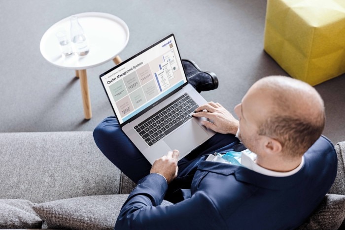 office_scene_iso_certificates_oem_man_with_laptop_oem_man_with_laptop____cmyk