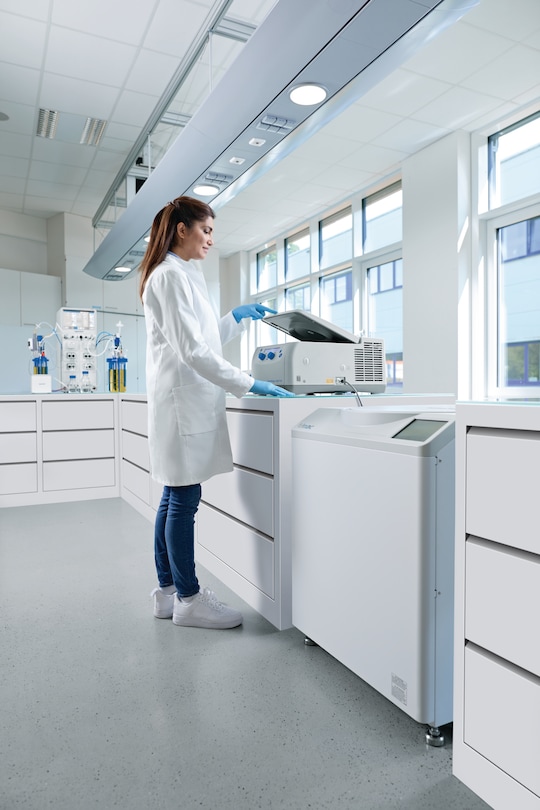 Woman closing microcentrifuge lid with one finger touch