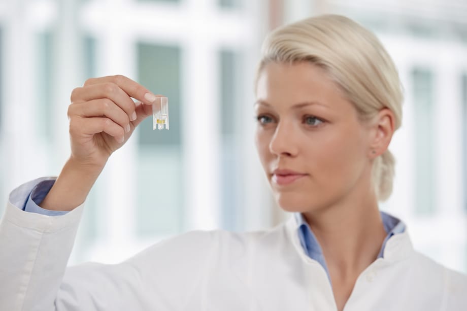 UVette and scientist Scientist looking at cuvette from Eppendorf