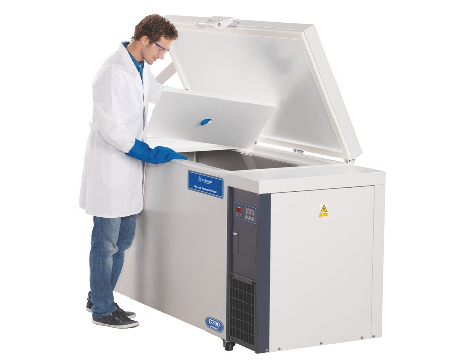 Eppendorf Innova_REG_ C760 ULT freezer: Open door Eppendorf Innova_REG_ C760 chest ULT freezer with lab scientist looking for samples