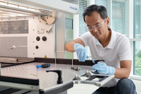 Eppendorf service technician checks shaker in lab