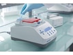 Lab person positions tube in Eppendorf ThermoMixer C with SmartExtender at the bench
