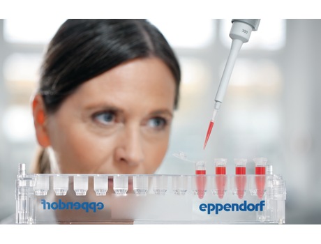Lab worker pipetting sample into microtubes