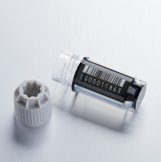 Barcoded Eppendorf CryoStorage Vial 1.5 mL lying on the bench, no cap