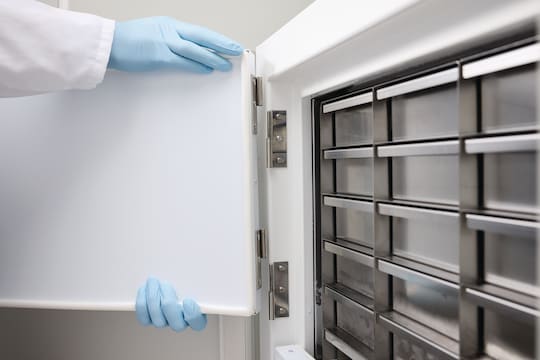 Scientist removing the inner door of an Eppendorf CryoCube_REG_ F101h ULT freezer