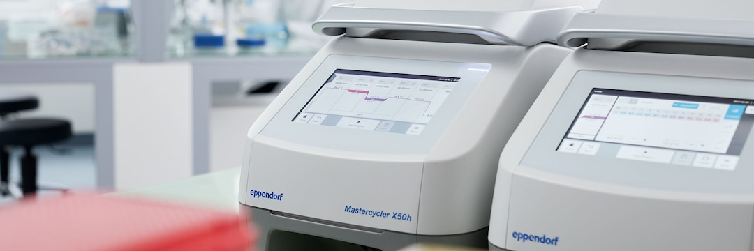 Two Eppendorf Mastercycler X50 with laboratory scene in the background