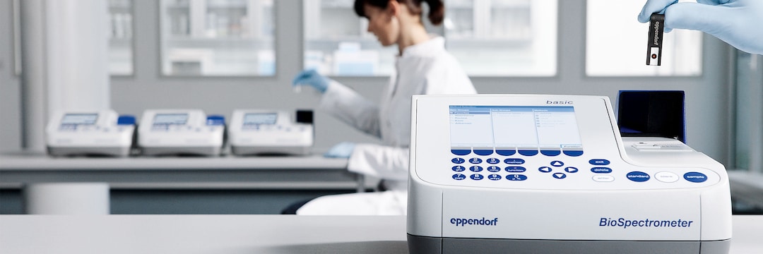 Lab scientist with Eppendorf BioSpectrometer_REG_ basic photometer in the foreground.